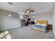 Cozy bedroom with a ceiling fan and carpet, offering a comfortable and relaxing space at 11036 Mount Hunter St, Las Vegas, NV 89179