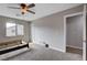 Bright bedroom with a large window and neutral carpet, awaiting your personal touch at 11036 Mount Hunter St, Las Vegas, NV 89179