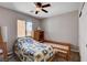 Bedroom featuring one bed, a fan, natural light, and carpeted floors at 11036 Mount Hunter St, Las Vegas, NV 89179