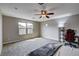 Sunlit bedroom with large windows and plush carpeting, perfect for a restful retreat at 11036 Mount Hunter St, Las Vegas, NV 89179