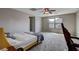 Bedroom with large windows, carpet and ceiling fan, offering a serene and inviting atmosphere at 11036 Mount Hunter St, Las Vegas, NV 89179