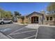 View of the community clubhouse featuring ample parking and a well-manicured entrance at 11036 Mount Hunter St, Las Vegas, NV 89179