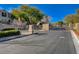 Gated community entrance with meticulously maintained landscaping offers security and an upscale living environment at 11036 Mount Hunter St, Las Vegas, NV 89179