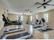 Community gym featuring treadmills, stationary bikes and weight machines with multiple windows providing natural light at 11036 Mount Hunter St, Las Vegas, NV 89179