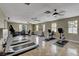 Community gym featuring treadmills, stationary bikes and weight machines with multiple windows providing natural light at 11036 Mount Hunter St, Las Vegas, NV 89179