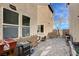 A paved patio, featuring plants, a grill, and furniture at 11036 Mount Hunter St, Las Vegas, NV 89179