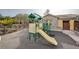 Community playground with slide, climbing structure and play area at 11036 Mount Hunter St, Las Vegas, NV 89179