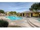 Community pool featuring lounge chairs and well-manicured landscaping around the sun-drenched pool area at 11036 Mount Hunter St, Las Vegas, NV 89179
