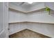 Walk-in closet with neutral carpet, white wall paint and organizers at 11036 Mount Hunter St, Las Vegas, NV 89179