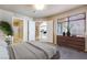 Bedroom featuring neutral tones, a view of the bathroom, and an additional view to the kitchen at 2723 Seabridge Dr, Las Vegas, NV 89121