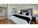 Modern bedroom featuring a cozy bed, contemporary artwork, and a view into the en-suite bathroom at 322 Karen Ave # 4207, Las Vegas, NV 89109