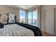 Bright bedroom with a view of the Stratosphere, large windows, and sliding glass doors to a balcony at 322 Karen Ave # 4207, Las Vegas, NV 89109