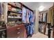 This walk-in closet includes custom wood storage and shelving at 322 Karen Ave # 4207, Las Vegas, NV 89109