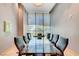 Modern conference room with a glass table, executive chairs, and sophisticated window treatments at 322 Karen Ave # 4207, Las Vegas, NV 89109