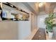 Hallway featuring decorative mirror, patterned floor, neutral walls, and a glimpse into other rooms at 322 Karen Ave # 4207, Las Vegas, NV 89109