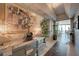Elegant condo entrance with mirrored console table, artwork, and a view into the light-filled living space at 322 Karen Ave # 4207, Las Vegas, NV 89109