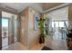 Hallway showing a view into the dining and living areas, featuring city views through large windows at 322 Karen Ave # 4207, Las Vegas, NV 89109