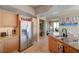 Contemporary kitchen with stainless steel appliances and granite countertops leading to the living room at 322 Karen Ave # 4207, Las Vegas, NV 89109