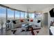 Spacious living room with a city view, comfortable seating, and natural light at 322 Karen Ave # 4207, Las Vegas, NV 89109