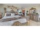 This bedroom features carved wood furniture, accent art, and neutral colored walls at 322 Karen Ave # 4207, Las Vegas, NV 89109
