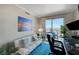 Office space with a daybed, desk setup, and balcony access, offering city views at 322 Karen Ave # 4207, Las Vegas, NV 89109