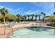 Inviting pool deck with lounge chairs, palm trees, and a charming gazebo provides a tranquil retreat at 322 Karen Ave # 4207, Las Vegas, NV 89109
