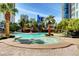 Stunning pool area with mature landscaping and rock features offers a luxurious outdoor oasis at 322 Karen Ave # 4207, Las Vegas, NV 89109