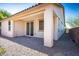 Covered patio with pavers, a stucco pillar, and a sliding glass door leading indoors at 4032 Little Bay Ave, North Las Vegas, NV 89081