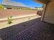 Backyard with brick paver patio and rock landscaping at 4032 Little Bay Ave, North Las Vegas, NV 89081