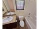 Well-lit bathroom features a granite countertop, sink, toilet, and a relaxing bathtub at 4032 Little Bay Ave, North Las Vegas, NV 89081
