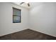 Clean, carpeted bedroom with neutral walls, blinds on the window, and a ceiling fan at 4032 Little Bay Ave, North Las Vegas, NV 89081