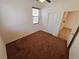 Bedroom with brown carpet, window and sliding closet doors at 4032 Little Bay Ave, North Las Vegas, NV 89081