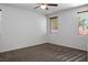 Spacious bedroom featuring carpet flooring, neutral colors, and natural lighting from multiple windows at 4032 Little Bay Ave, North Las Vegas, NV 89081