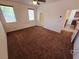 Spacious bedroom with neutral walls, carpeted flooring, a ceiling fan, and abundant natural light at 4032 Little Bay Ave, North Las Vegas, NV 89081