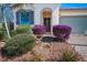 Charming home with a brick paved driveway, well-kept landscaping and desert foliage at 4032 Little Bay Ave, North Las Vegas, NV 89081