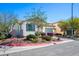Cozy home with a well-maintained yard, charming desert landscaping, and a view of the side gate at 4032 Little Bay Ave, North Las Vegas, NV 89081