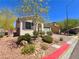 Charming single story home with a desert landscaped yard, colorful foliage, and two-car garage at 4032 Little Bay Ave, North Las Vegas, NV 89081