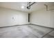 Spacious three car garage with automatic door opener and painted walls and floors at 4032 Little Bay Ave, North Las Vegas, NV 89081