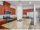 Kitchen featuring stainless steel appliances, granite countertops, and plenty of storage space at 4032 Little Bay Ave, North Las Vegas, NV 89081
