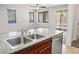 Bright kitchen featuring a stainless steel dishwasher, granite countertops and recessed lighting at 4032 Little Bay Ave, North Las Vegas, NV 89081