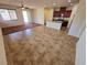 Open floor plan featuring tile floors, kitchen island, and a sliding door to the back yard at 4032 Little Bay Ave, North Las Vegas, NV 89081