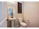 Half bathroom featuring a pedestal sink and toilet at 4533 Queens Hill St, North Las Vegas, NV 89031