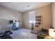 Cozy bedroom featuring ample desk space, shelving, and natural light at 4533 Queens Hill St, North Las Vegas, NV 89031