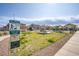 Well-maintained community park with green space, playground, and pet waste station, offering a recreational area for residents at 4533 Queens Hill St, North Las Vegas, NV 89031