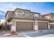 A two-car garage exterior highlighting the home's ample parking and traditional design at 4533 Queens Hill St, North Las Vegas, NV 89031
