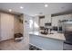 Bright kitchen boasts a large island, stainless steel appliances, and ample cabinet space at 4533 Queens Hill St, North Las Vegas, NV 89031