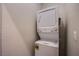 Efficient stacked washer and dryer in a dedicated laundry area at 4533 Queens Hill St, North Las Vegas, NV 89031