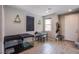 Cozy bonus room showcasing wood-look floors, two windows, and versatile space perfect for relaxing or entertaining at 4533 Queens Hill St, North Las Vegas, NV 89031