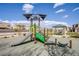 Community playground equipment featuring slides and climbing structures for children to enjoy, creating a safe and fun play environment at 4533 Queens Hill St, North Las Vegas, NV 89031