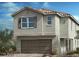 Charming two-story home with a neutral color palette and a two-car garage at 10038 Indy Rey Ct, Las Vegas, NV 89148
